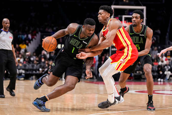 Mar 10, 2024; Atlanta, Georgia, USA; New Orleans Pelicans forward Zion Williamson (1) dribbles against Atlanta Hawks forward De'Andre Hunter (12) during the second half at State Farm Arena. Mandatory Credit: Dale Zanine-USA TODAY Sports